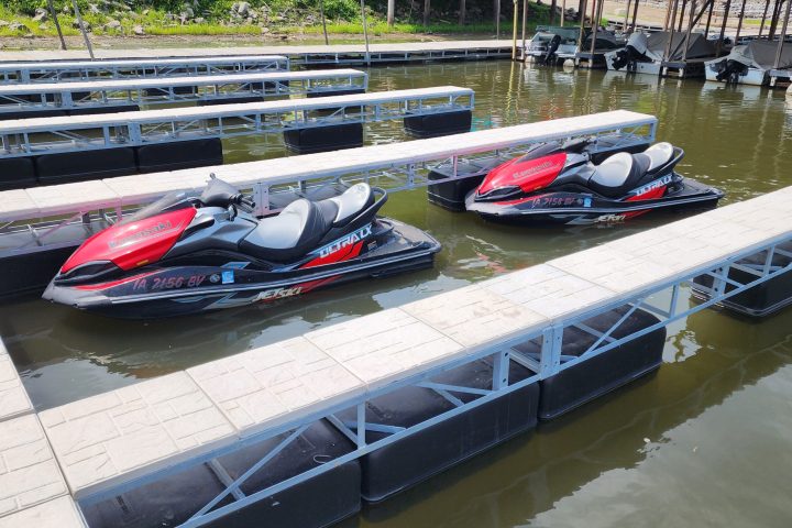 a boat is docked next to a body of water